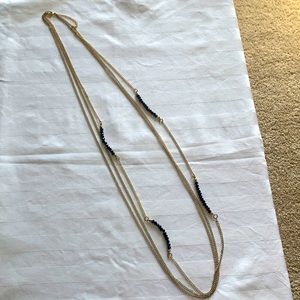 gold necklace with black beads